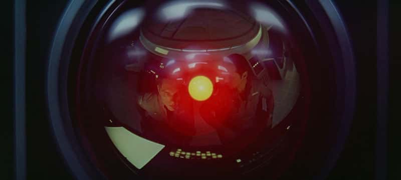 The image shows a red and yellow glowing orb-like object surrounded by a dark, blurry background, suggesting a futuristic or sci-fi setting.